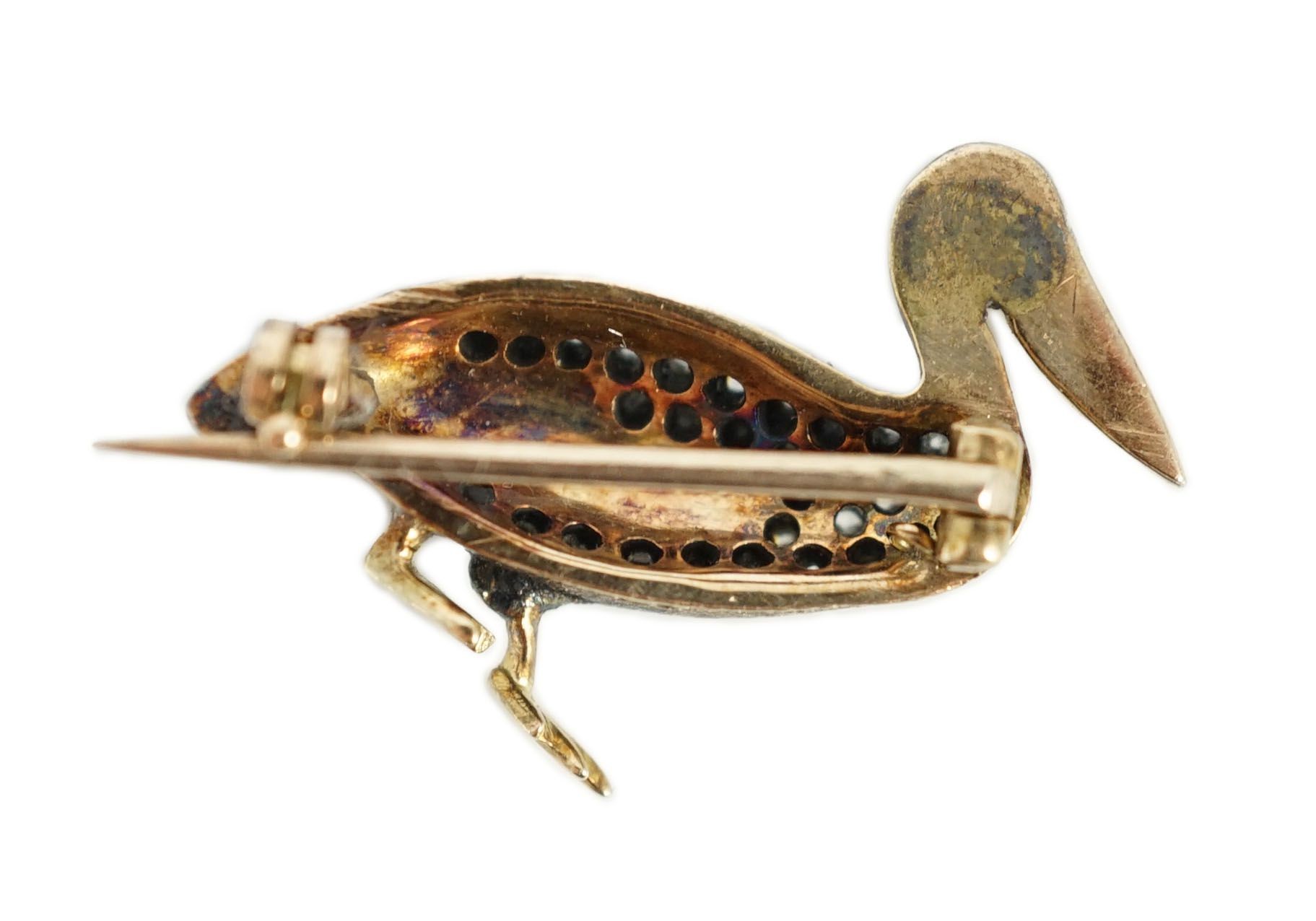 A Victorian style diamond encrusted and ruby set brooch, modelled as a pelican